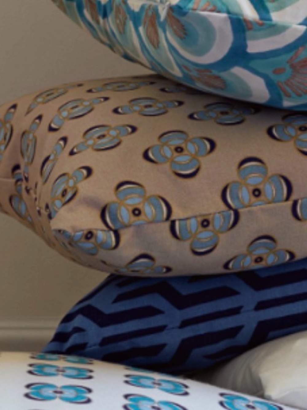 Serena & Lily outdoor Patterned Throw Pillow. Tan with blue geometric pattern